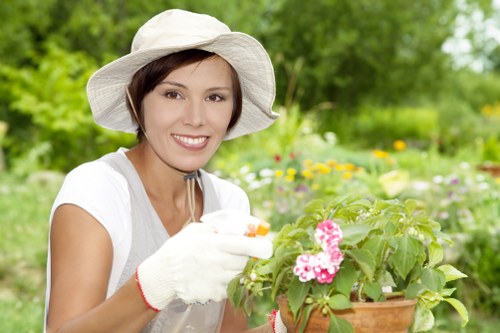Professional gardener maintaining a Canary Wharf garden